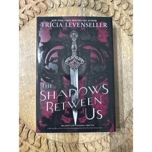 The Shadows Between Us by Tricia Levenseller Hardcover Book Sprayed Edges